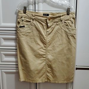 Dolce & Gabbana tan denim skirt. size 28, with slit on left side